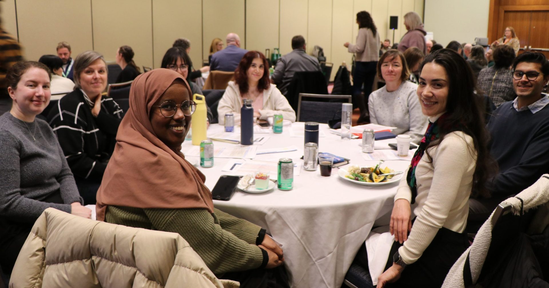 A group of OLA councillors sit together at Orientation at SC26.
